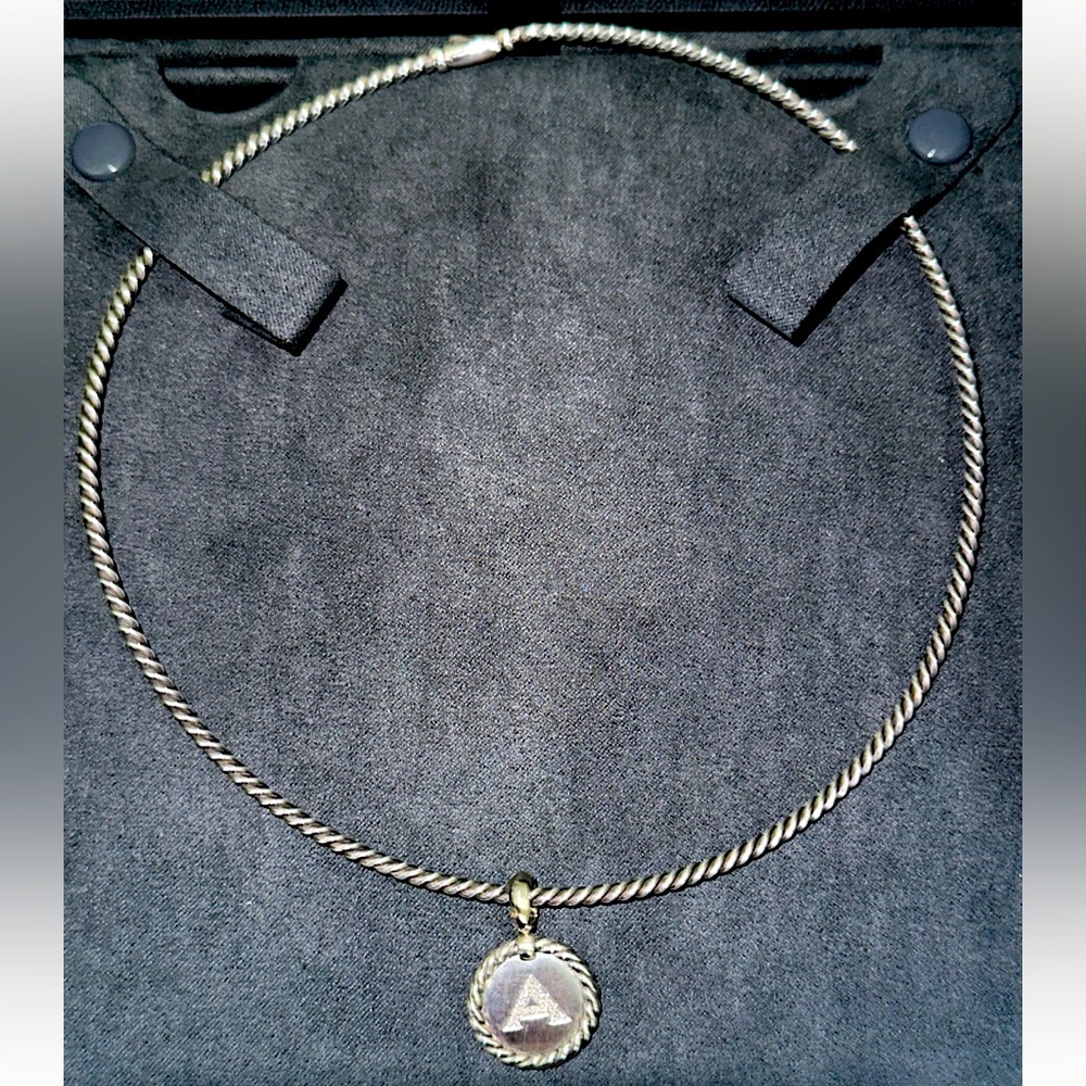 Authentic from DY Elegant Sterling Silver Necklace Brand New never used.